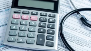 Calculator on insurance papers