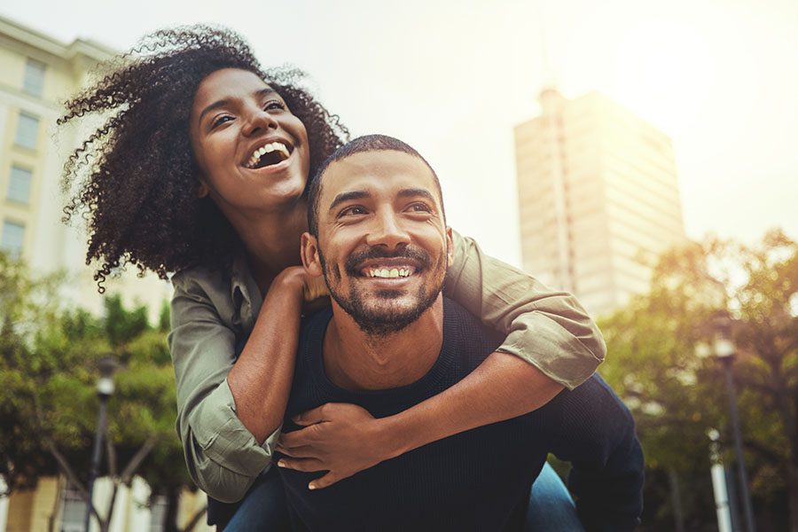 Life Insurance - Young Couple Having Fun In The City